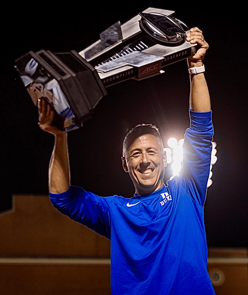 Matt LoPiccolo celebrating with championship trophy